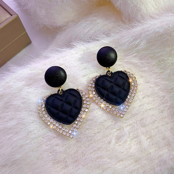 Boucles d'oreilles en cœur noir en or