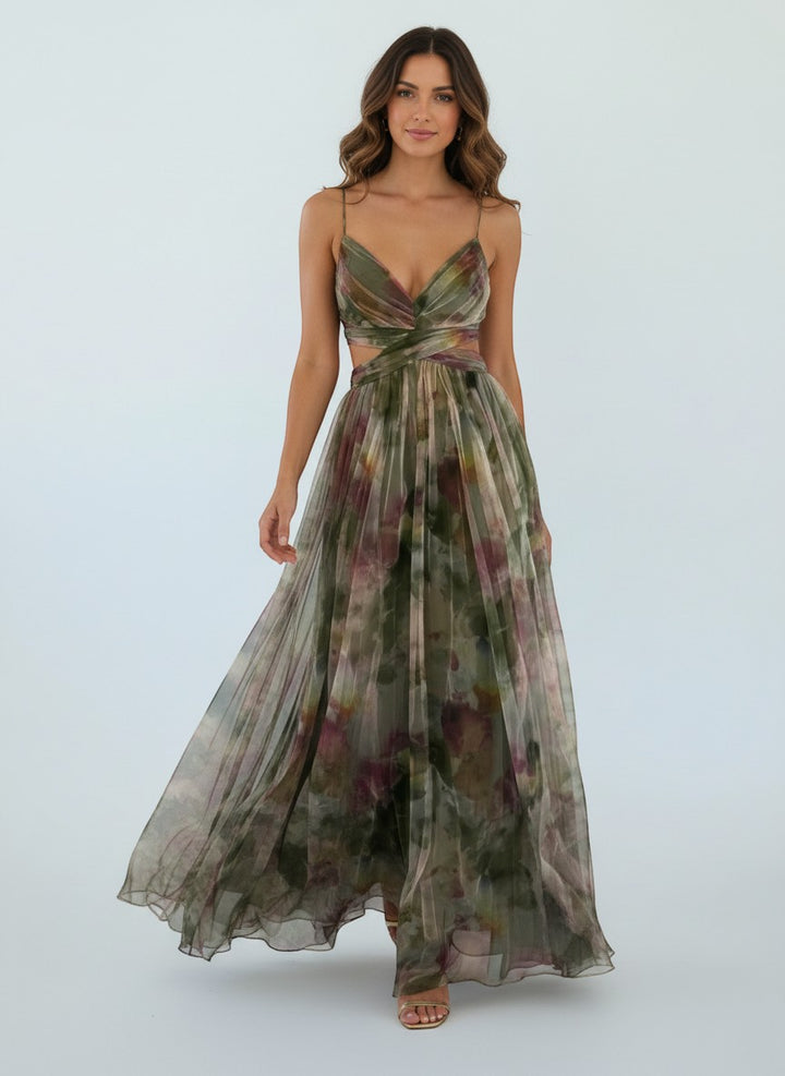 Maison Amélie Paris artistic floral print maxi dress with flowing skirt and cutout waist. Green and purple watercolour design.
