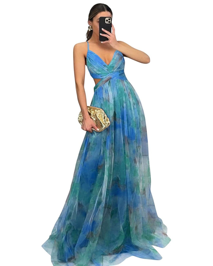 Maison Amélie Paris Émilienne long artistic dress in blue and green watercolor print, with flowing skirt and cut-out waist.