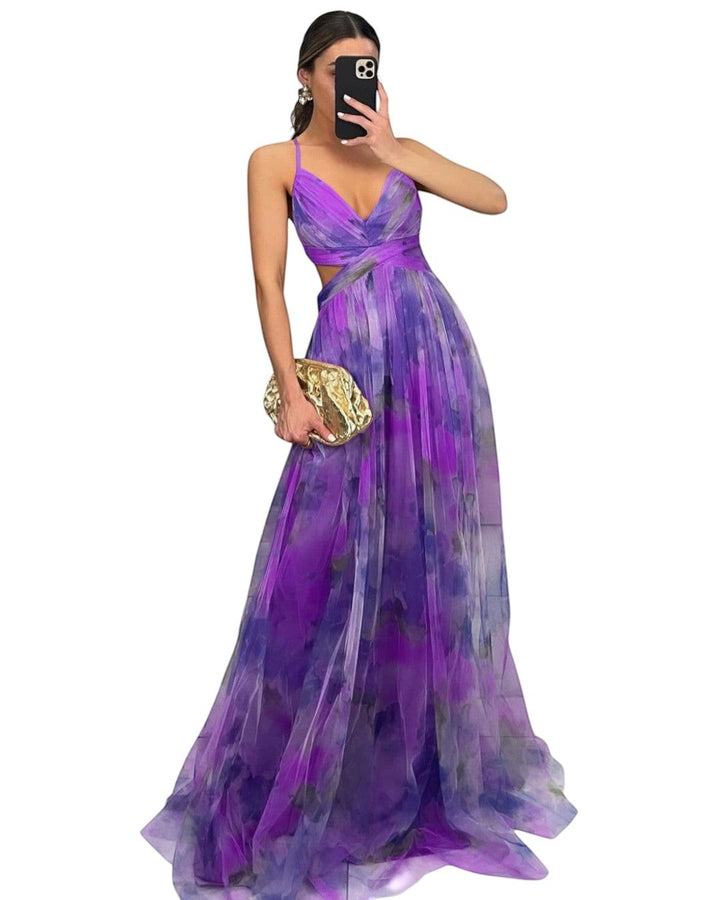 Maison Amélie Paris long flowing artistic dress in purple and blue watercolor print, featuring a V-neck and cut-out waist.